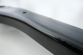 Varnish-like coating on the side member